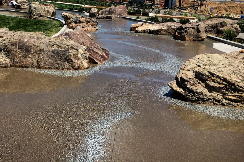 Stream bed includes lithocrete decorative concrete in Denver. Colorado.