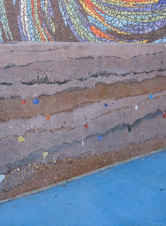 Sedimentary wall has aggregate within wall