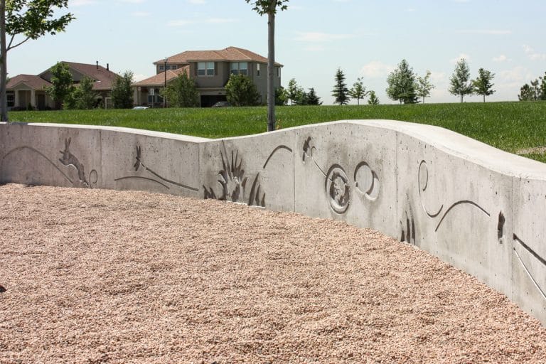 Pictures and designs on short concrete wall