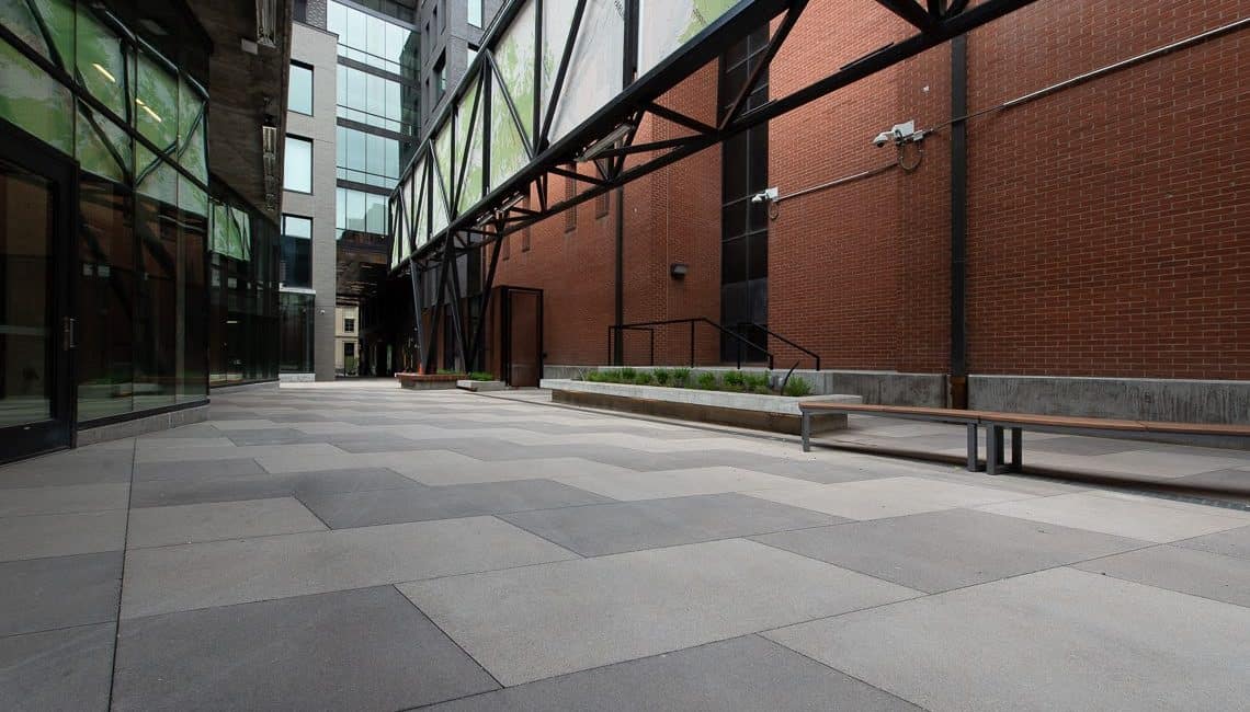 Market Station concrete plaza with stained bands done by Colorado Hardscapes 2021.