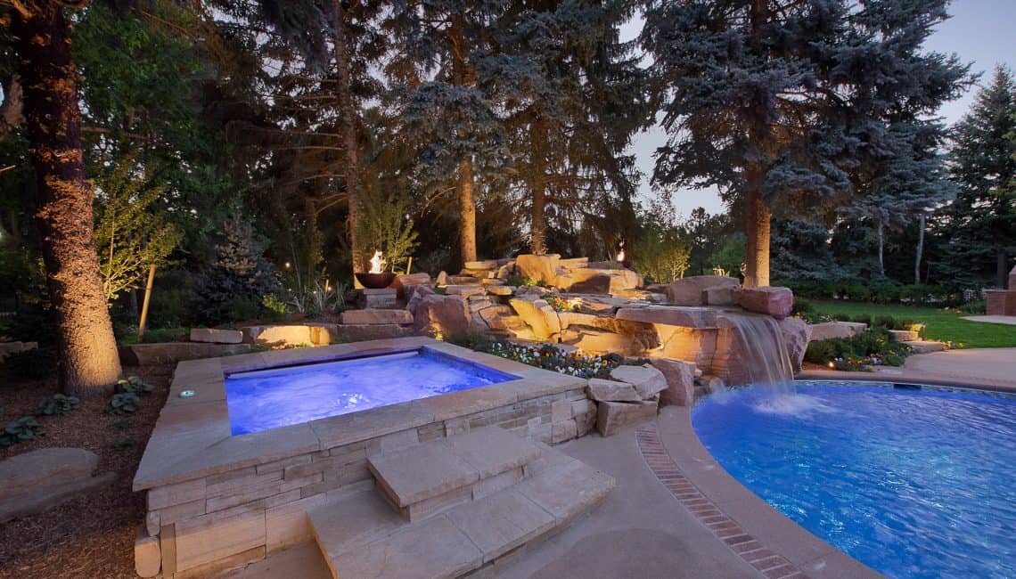 Dream backyard at private residence with sandstone waterfall and spa.