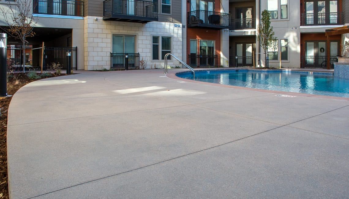 Photo of concrete pool deck at the Flatiron Marketplace Apartments.